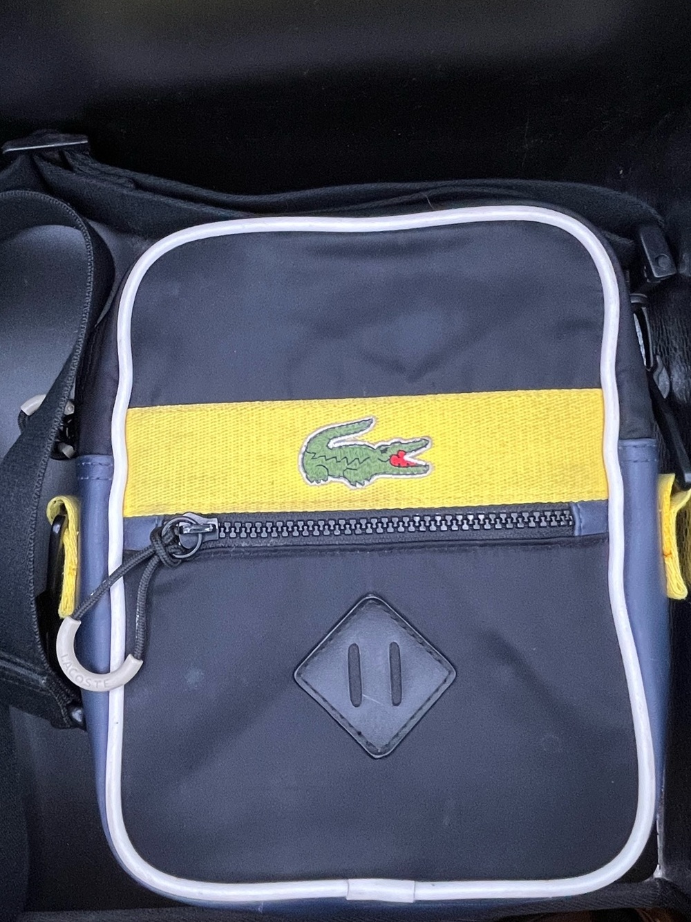Authentic Lacoste vertical messenger bag